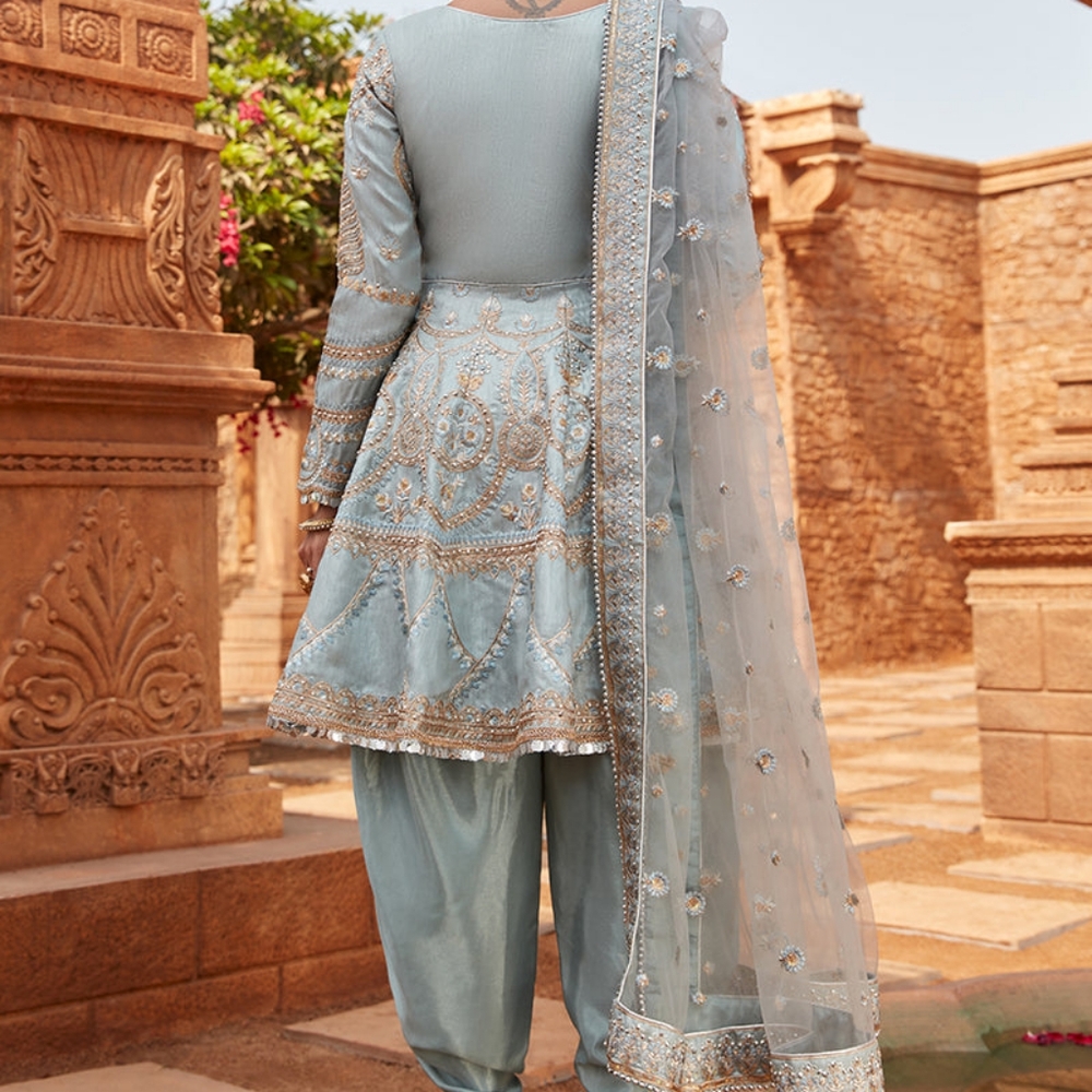Up for grabs is a premium Dusty Blue Dhoti Style Punjabi Suit designed by Laksha